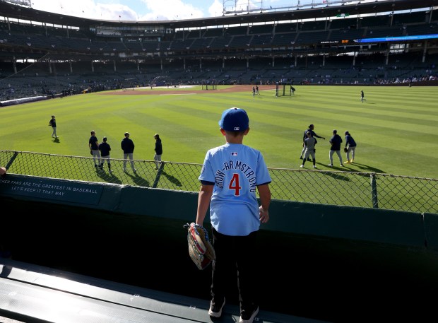 A young fan takes in batting practice from the center...