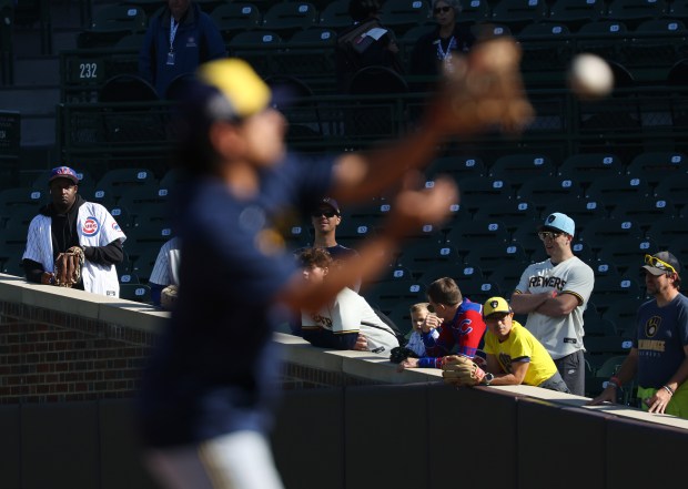 Fans watch Brewers players warm up for the NLDS Game...