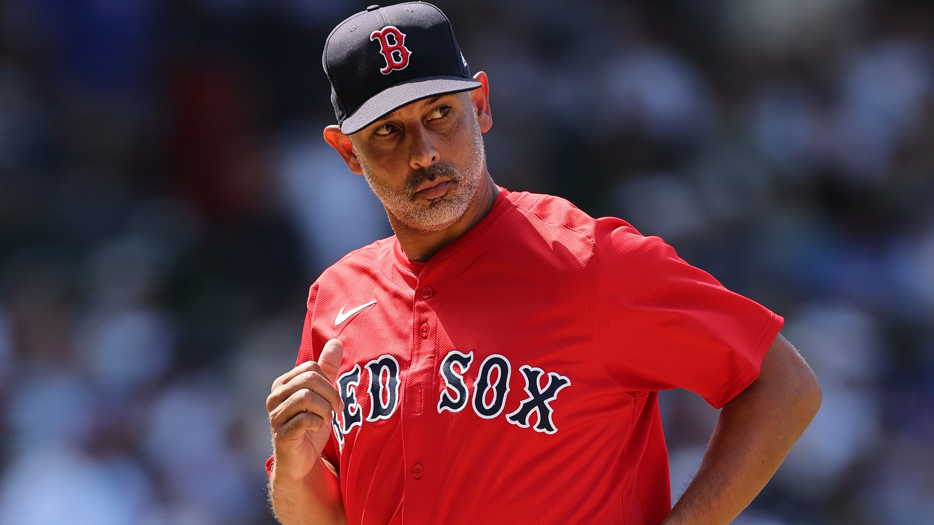 CHICAGO, ILLINOIS - JULY 18: Alex Cora #13 of the Boston Red Sox looks on during the sixth inning against the Chicago Cubs at Wrigley Field on July 18, 2025 in Chicago, Illinois. (Photo by Michael Reaves/Getty Images)