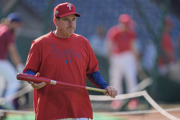 Phillies manager Rob Thomson walks to the outfield during batting practice before Game 2 of the NLDS against the Los Angeles Dodgers on Oct. 6. (AP Photo/Matt Rourke)