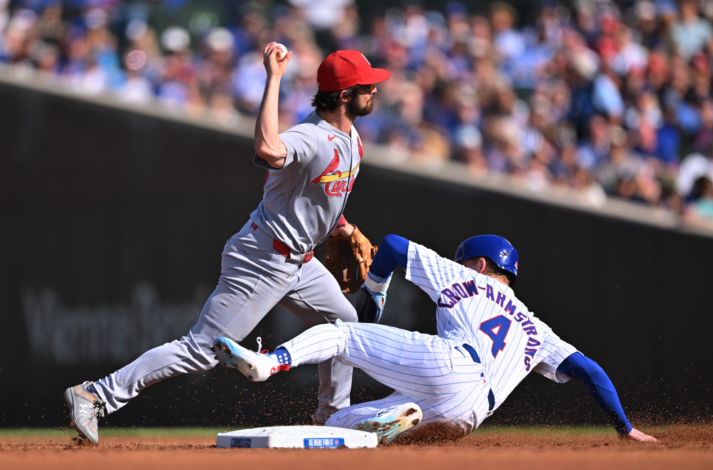 CHICAGO, ILLINOIS - SEPTEMBER 28: Thomas Saggese #25 of the St. Louis Cardinals turns a double play as Pete Crow-Armstrong #4 of the Chicago Cubs slides into second base during the third inning at Wrigley Field on September 28, 2025 in Chicago, Illinois. (Photo by Daniel Bartel/Getty Images)