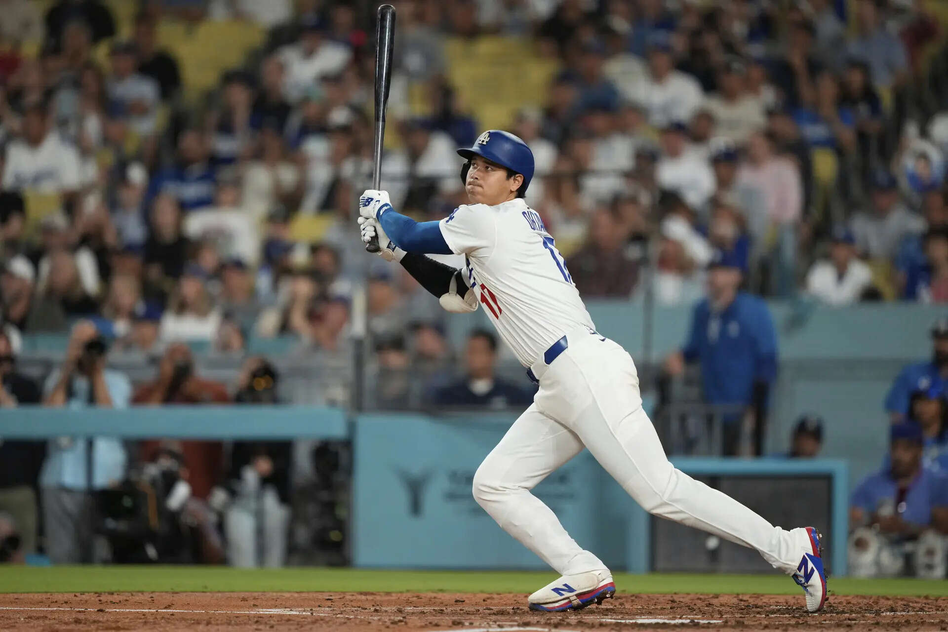 Los Angeles Dodgers' Shohei Ohtani watches his fly out during the second inning of a baseball game against the Philadelphia Phillies Wednesday, Sept. 17, 2025, in Los Angeles. (AP Photo/Mark J. Terrill) Blake Snell strikes out season-high 12, Shohei Ohtani hits 51st homer as Dodgers beat Phillies 5-0