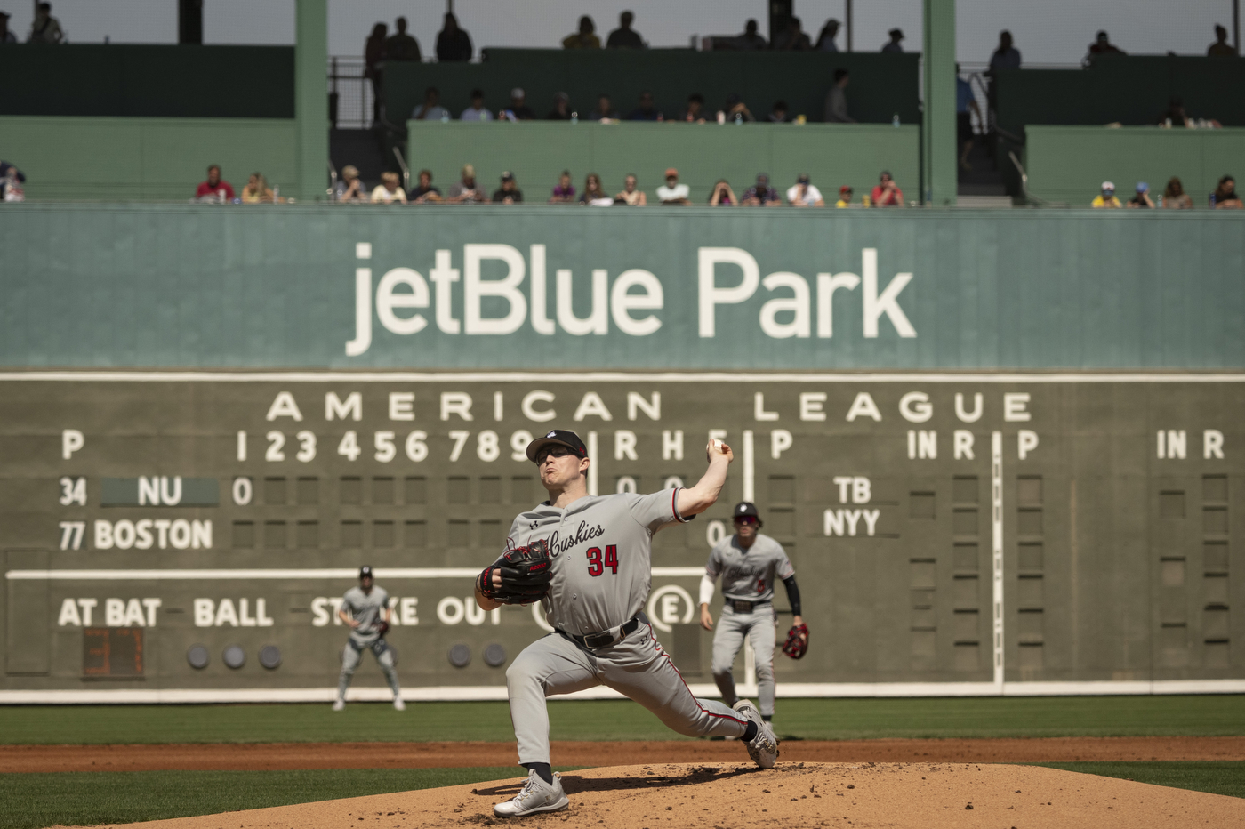 Northeastern pitcher Max Gitlin throws a pitch during the first inning of the Huskies' spring training game against the Red Sox at JetBlue Park.