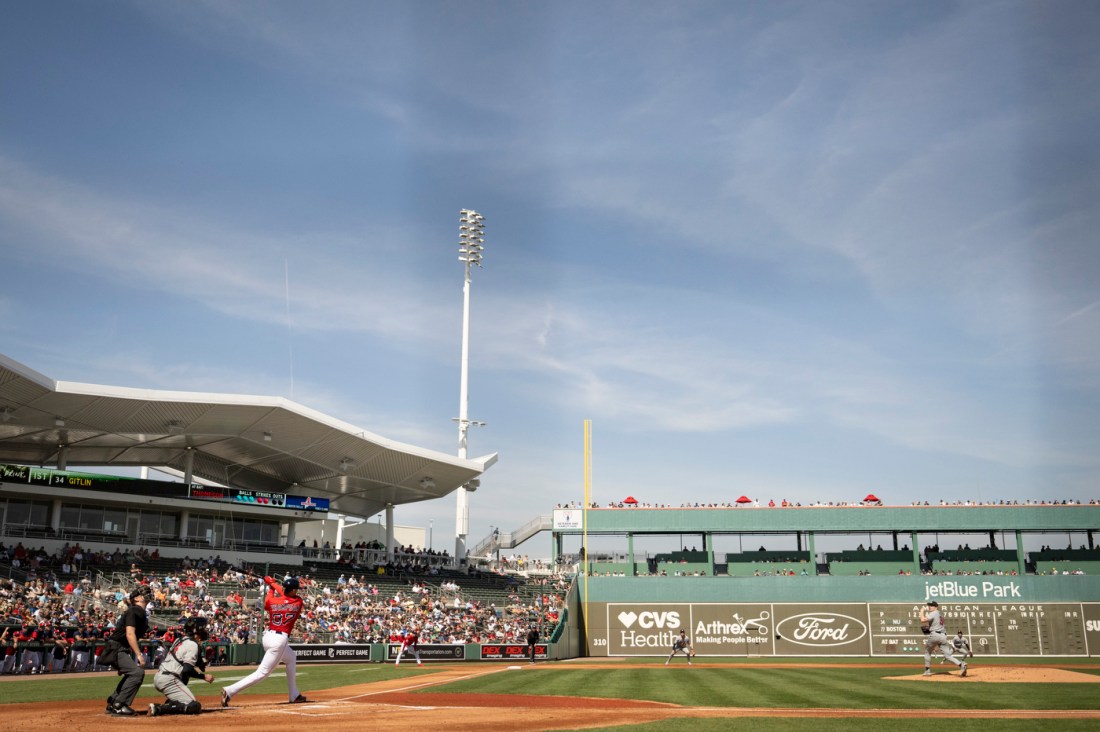Wide-angle shot of JetBlue Park with players on the field during the Northeastern vs. Red Sox spring training exhibition game.