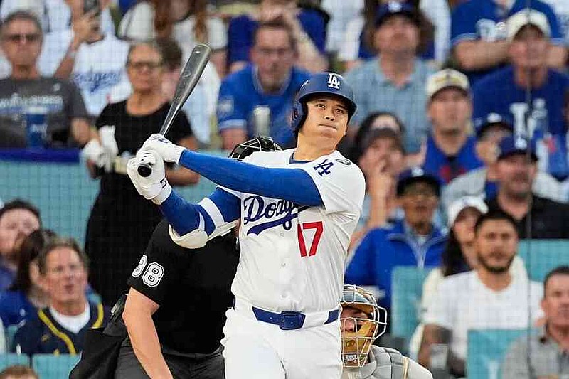 Los Angeles Dodgers' Shohei Ohtani watches his home run during the first inning against the Milwaukee Brewers in Game 4 of the National League Championship Series on Oct. 17 in Los Angeles. (AP Photo/Mark J. Terrill, File)
