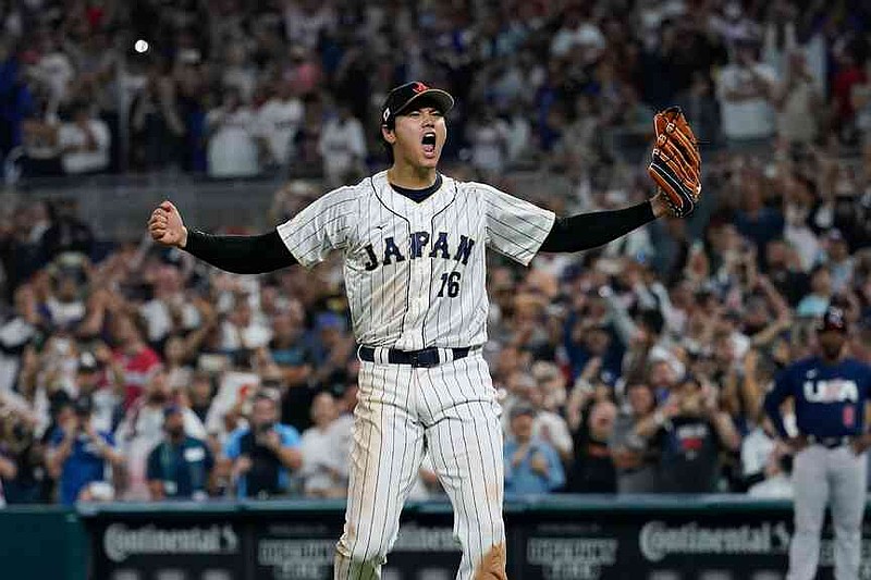 FILE - Japan pitcher Shohei Ohtani (16) celebrates after defeating the United States in the championship game of the  World Baseball Classic, Tuesday, March 21, 2023, in Miami. (AP Photo/Marta Lavandier, File)