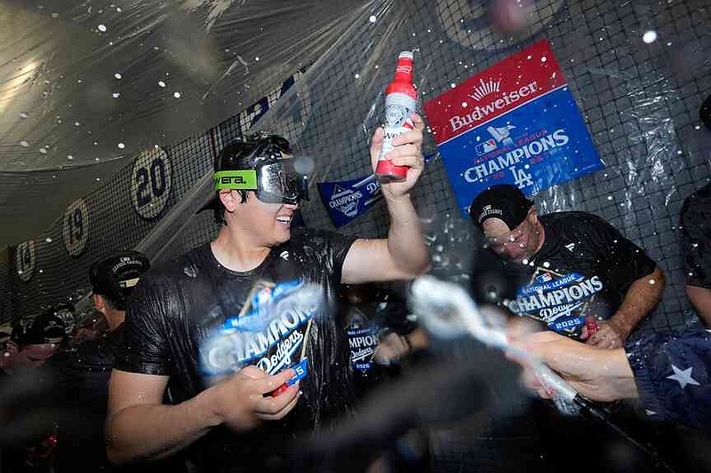 Los Angeles Dodgers pitcher Shohei Ohtani celebrates their win against the Milwaukee Brewers in baseball's National League Championship Series, Friday, Oct. 17, 2025, in Los Angeles.(AP Photo/Ashley Landis)
