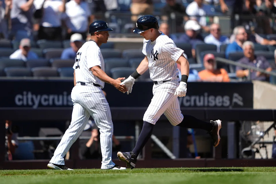 Aug 27, 2025; Bronx, New York, USA; New York Yankees third base coach Luis Rojas (67) congratulates New York Yankees first baseman Ben Rice (22) for hitting a home run as he rounds the bases during the third inning against the Washington Nationals at Yankee Stadium. Mandatory Credit: Gregory Fisher-Imagn Images