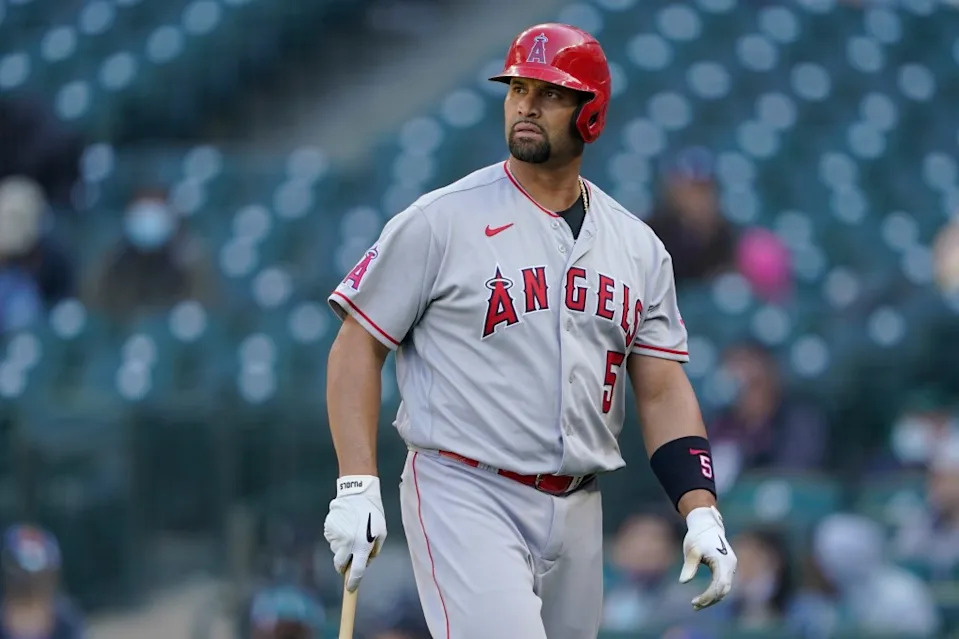 Los Angeles Angels Albert Pujols walks to the dugout after he was called out on strikes during the ninth inning of a baseball game against the Seattle Mariners, Sunday, May 2, 2021, in Seattle. AP