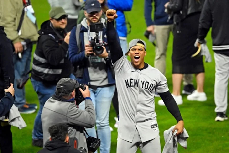 New York Yankees outfielder Juan Soto (22) celebrates after beating the Cleveland Guardians during game five of the ALCS for the 2024 MLB playoffs at Progressive Field.David Richard-Imagn Images