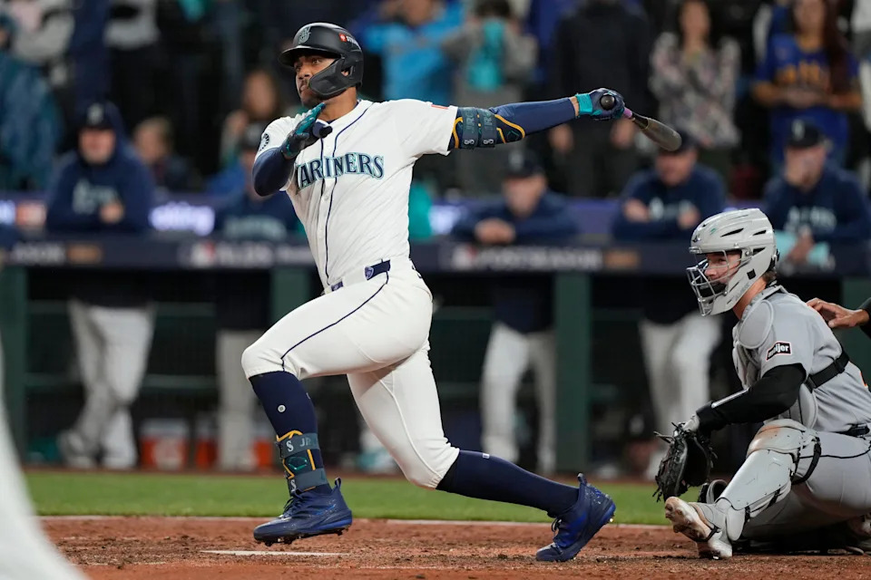 Seattle Mariners center fielder Julio Rodriguez (44) hits an RBI double against the Detroit Tigers in the eighth inning during Game 2 of the ALDS at T-Mobile Park in Seattle on Sunday, Oct. 5, 2025.
