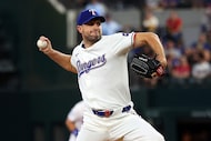Texas Rangers starting pitcher Max Scherzer (31) delivers in the first inning of a baseball...