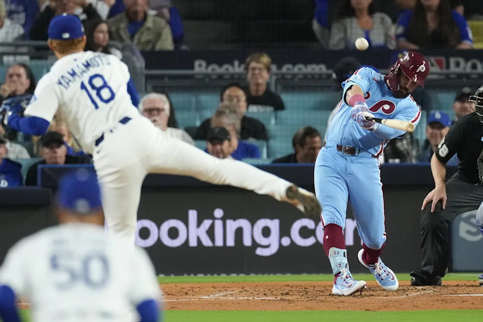 Philadelphia Phillies' Kyle Schwarber connects for a solo home run off Los Angeles Dodgers starting pitcher Yoshinobu Yamamoto during the fourth inning in Game 3 of baseball's National League Division Series Wednesday, Oct. 8, 2025, in Los Angeles. (AP Photo/Jae C. Hong)