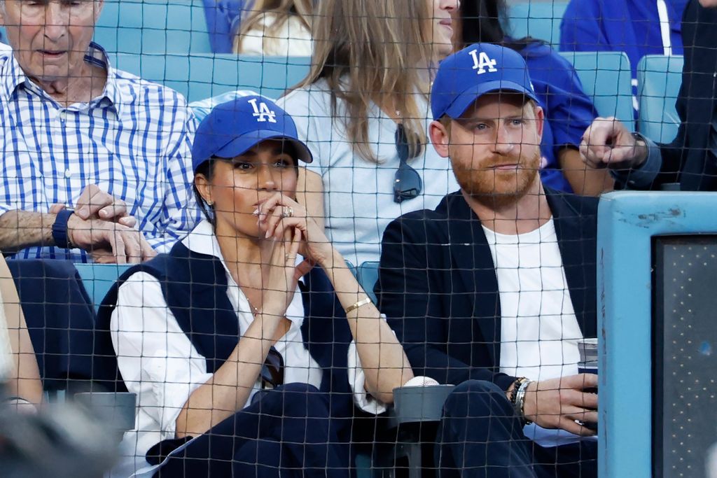 Harry and Meghan watch on with baited breath
