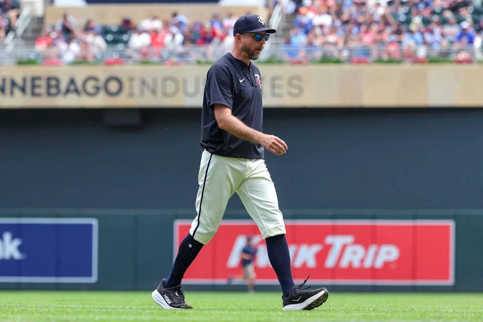 Rocco Baldelli walking onto MLB field