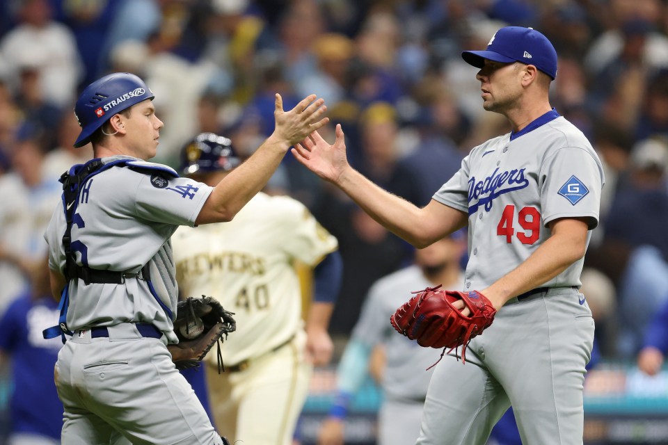 Will Smith and Blake Treinen celebrate after clinching a 2-1 victory for the LA Dodgers over the Milwaukee Brewers