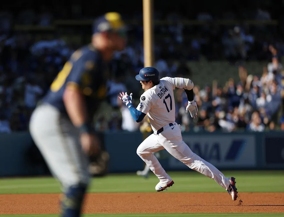 Dodgers star Shohei Ohtani runs the bases on a leadoff triple against the Brewers in the first inning of Game 3.