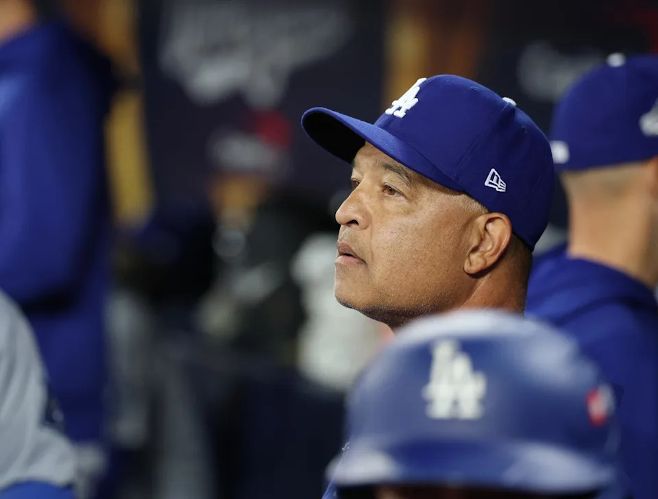 Dodgers manager Dave Roberts watches from the dugout in the eighth inning of Game 2 of the World Series.