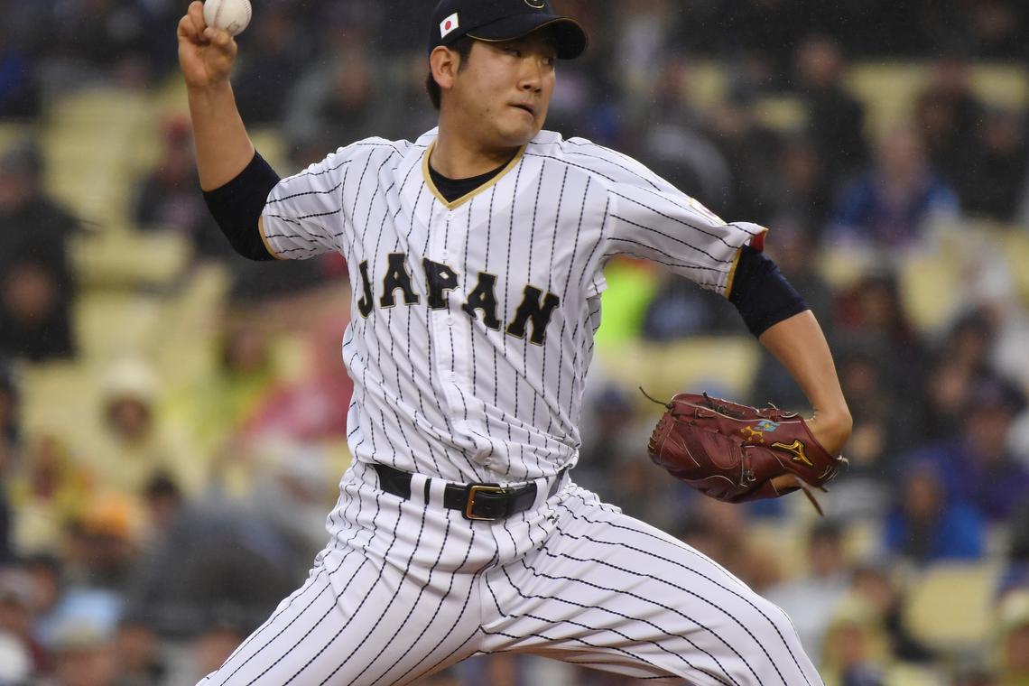 FILE PHOTO: Mar 21, 2017; Los Angeles, CA, USA; Japan pitcher Tomoyuki Sugano (11) throws a pitch during the first inning against United States during the 2017 World Baseball Classic at Dodger Stadium. Mandatory Credit: Robert Hanashiro-USA TODAY Sports/File Photo