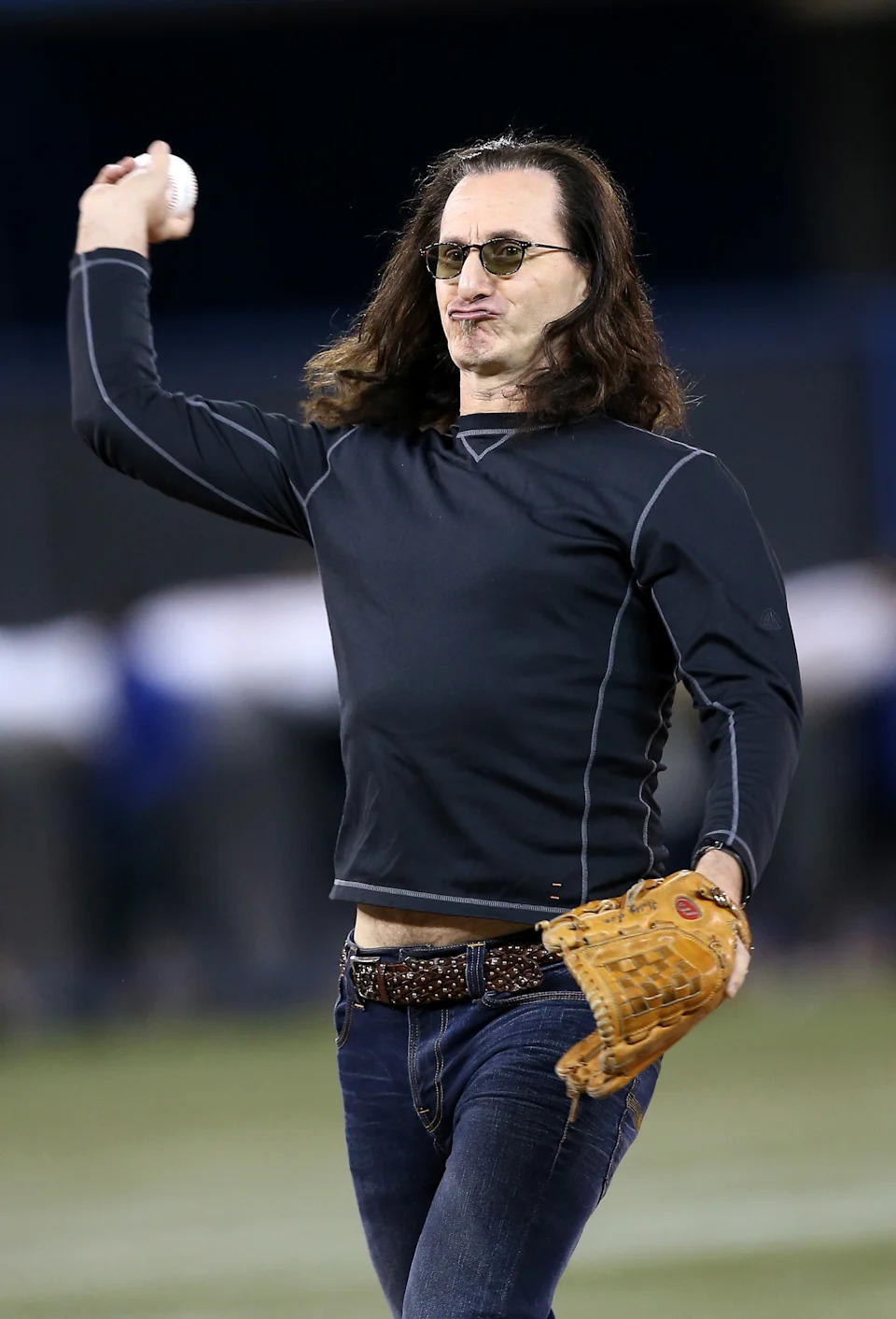 TORONTO, CANADA - APRIL 2: Rush singer Geddy Lee throws out the first pitch before the Cleveland Indians MLB game against the Toronto Blue Jays during Opening Day on April 2, 2013 at Rogers Centre in Toronto, Ontario, Canada. (Photo by Tom Szczerbowski/Getty Images)