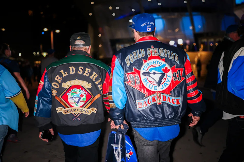 Baseball fans leave the Rogers Centre following the Toronto Blue Jays World Series game 1 win over the Los Angeles Dodgers in Toronto on Friday, October 24, 2025. THE CANADIAN PRESS/Nick Iwanyshyn