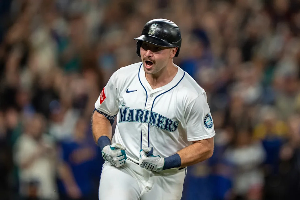 Seattle Mariners catcher Cal Raleigh celebrates after hitting a solo home run during the eighth inning against the Colorado Rockies at T-Mobile Park.