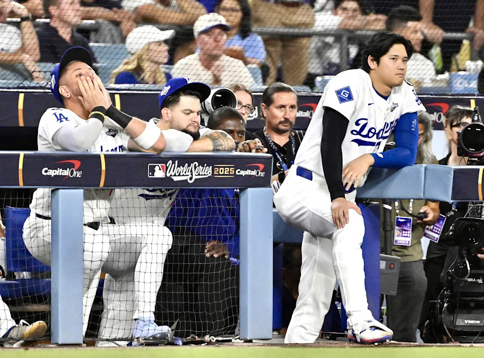 Los Angeles, CA - October 29:  Shohei Ohtani, right, along with Andy Pages and Miguel Rojas, left of the Los Angeles Dodgers look on in the ninth inning of Game 5 of a World Series Baseball game against the Toronto Blue Jays at Dodger Stadium in Los Angeles on Wednesday, October 29, 2025. (Photo by Keith Birmingham/MediaNews Group/Pasadena Star-News via Getty Images)