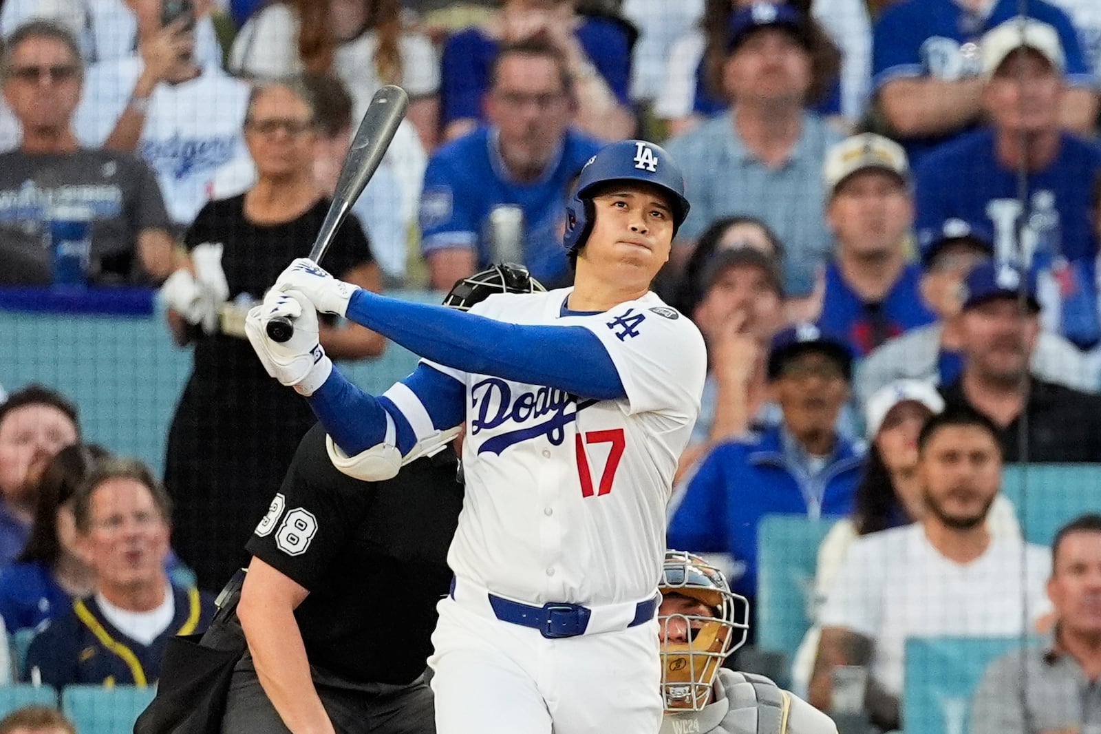 FILE - Los Angeles Dodgers' Shohei Ohtani watches his home run during the first inning against the Milwaukee Brewers in Game 4 in baseball's National League Championship Series, Friday, Oct. 17, 2025, in Los Angeles. (AP Photo/Mark J. Terrill, File)