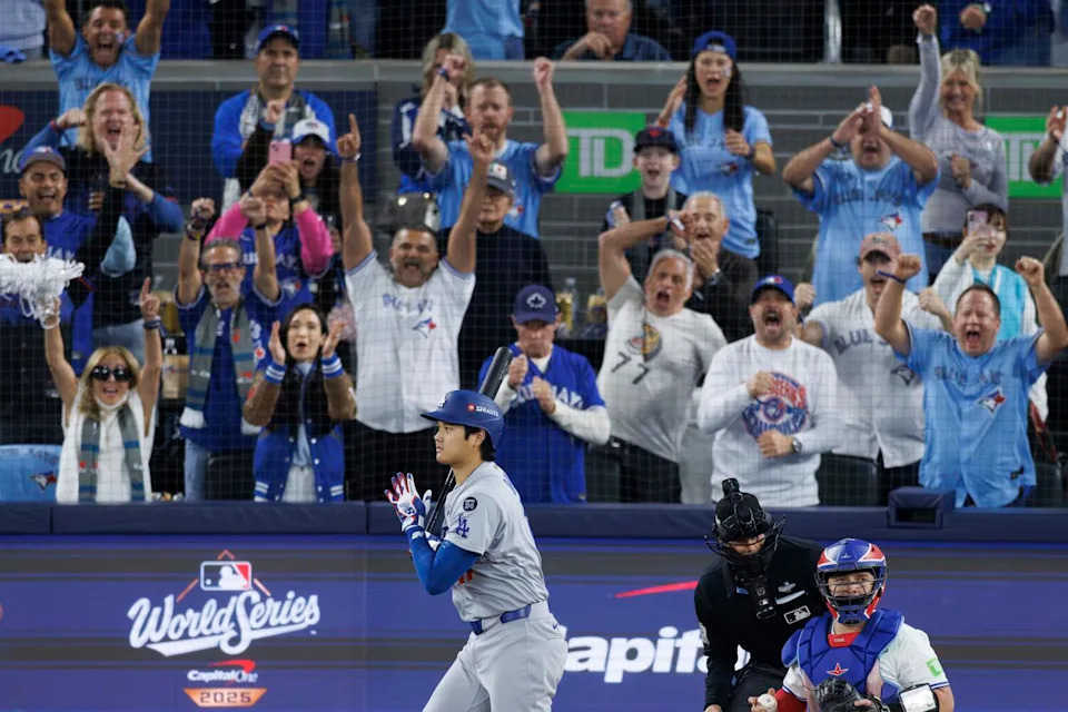 Blue Jays fans celebrate after Shohei Ohtani strikes out in the first inning of Game 1 of the World Series on Friday.