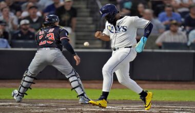 Tampa Bay Rays' Junior Caminero scores on an RBI single by Christopher Morel as the ball skips away from Cleveland Guardians catcher Bo Naylor during the first inning of a baseball game Thursday, Sept. 4, 2025, in Tampa, Fla. (AP Photo/Chris O'Meara)
