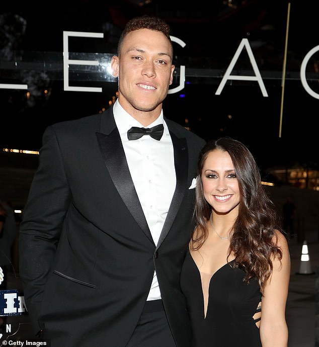 Aaron Judge, with wife Samantha Bracksieck, hurt his elbow making a throw at Toronto in July
