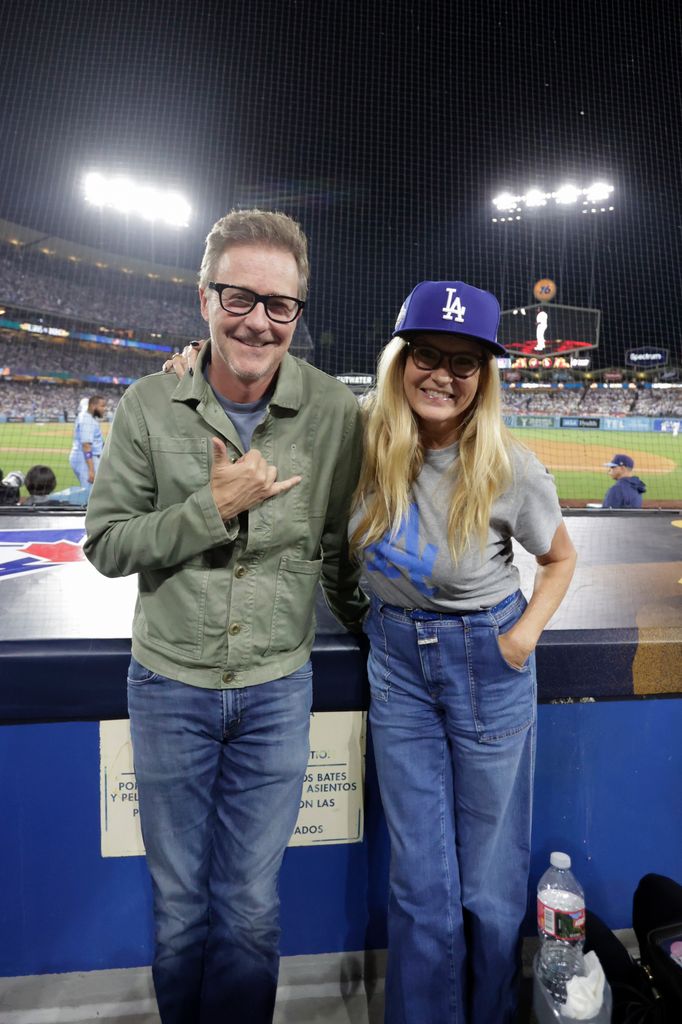 Edward Norton and Connie Britton pose for a photo during Game Four of the 2025 World Series presented by Capital One between the Toronto Blue Jays and the Los Angeles Dodgers at Dodger Stadium on Tuesday, October 28, 2025 in Los Angeles, California. 