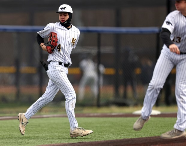 Metea Valley's Tyler Gluting (4) makes his way to right field between innings during a nonconference game against Larkin Tuesday, April 1, 2025 at Judson University's Hoffer Field in Elgin. (H. Rick Bamman / The Beacon-News)