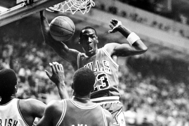 Michael Jordan dunks during his 63-point performance in the Bulls' 135-131 double-overtime playoff loss to the Celtics on April 21, 1986, at Boston Garden. (AP Photo/Elise Amendola)