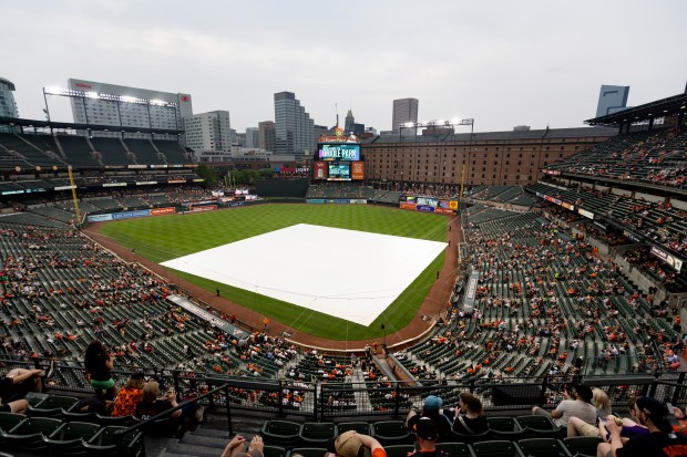 The scoreboard warns of inclement weather in the area as...