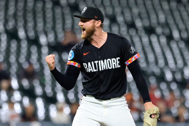 Baltimore Orioles relief pitcher Bryan Baker reacts after striking out...