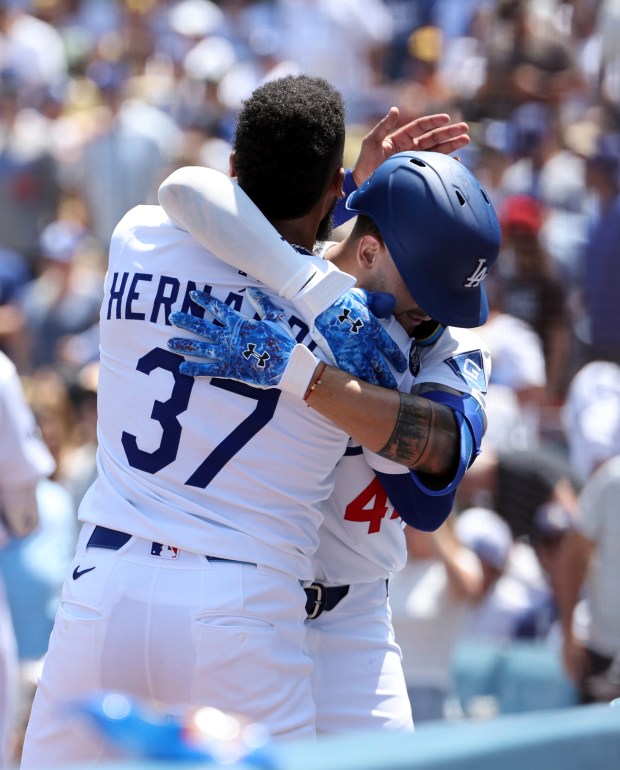 The Dodgers’ Andy Pages, right, is congratulated by teammate Teoscar...