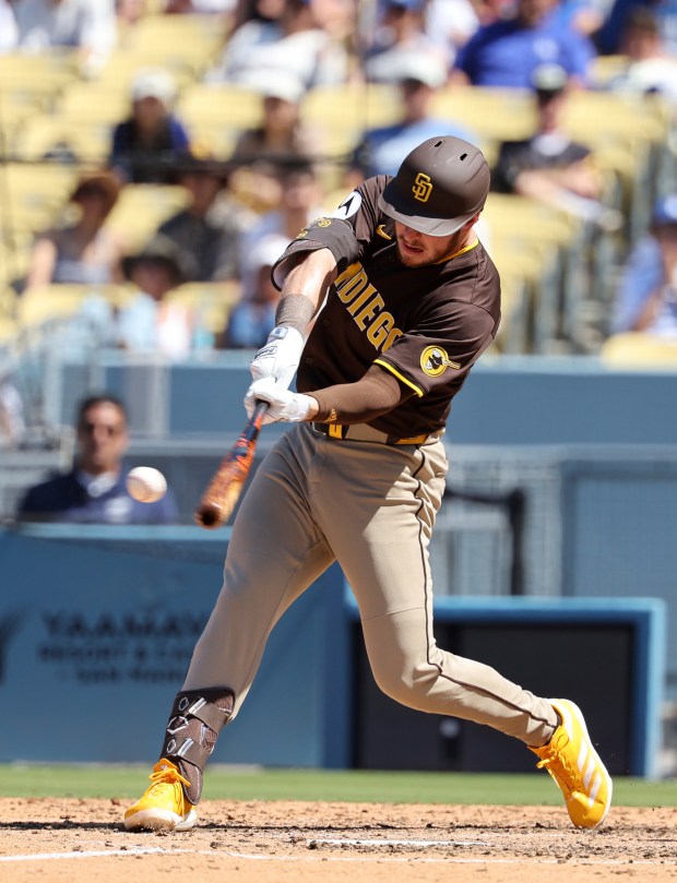 The Padres’ Ryan O’Hearn hits an RBI double on Sunday....