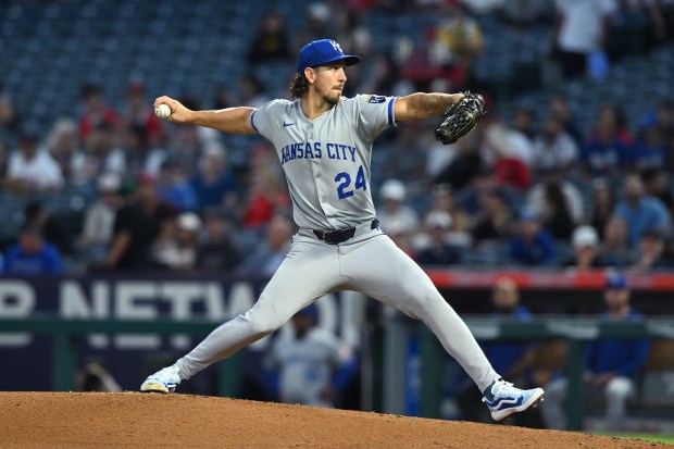 Kansas City Royals starting pitcher Michael Lorenzen throws to the...