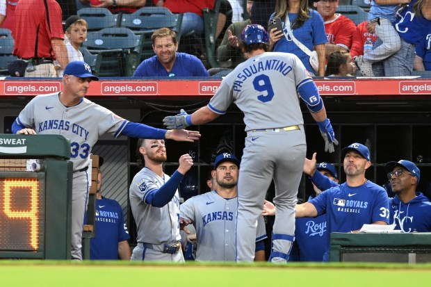 The Kansas City Royals’ Vinnie Pasquantino (9) celebrates with teammates...