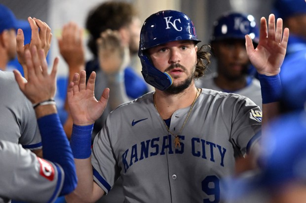 The Kansas City Royals’ Vinnie Pasquantino celebrates in the dugout...