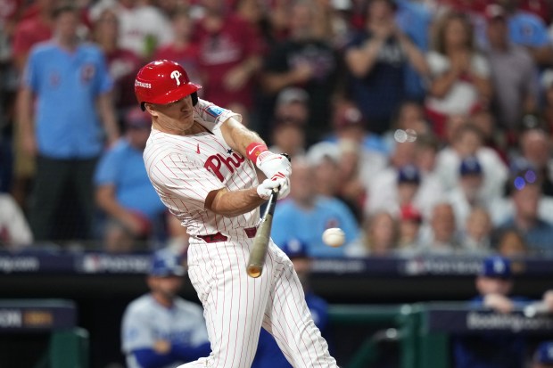 The Philadelphia Phillies’ J.T. Realmuto hits a two-run triple against...