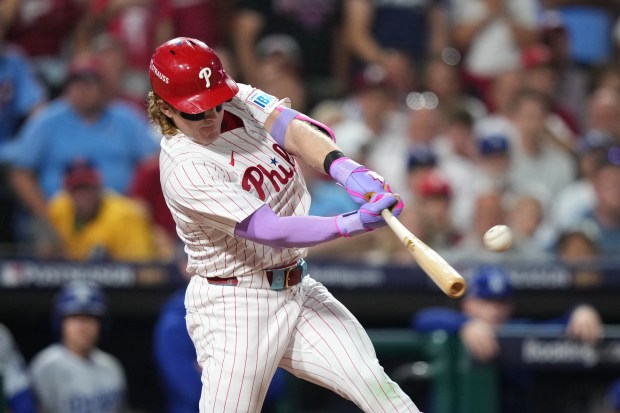 The Philadelphia Phillies’ Harrison Bader drives in a run with...