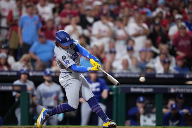 The Dodgers’ Kike Hernande hits a two-run double against Philadelphia...