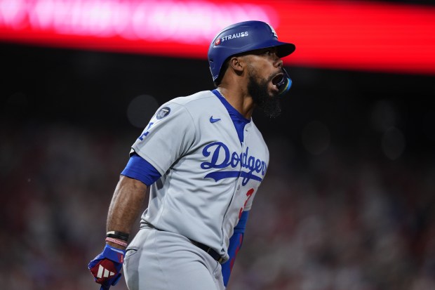 The Dodgers’ Teoscar Hernández celebrates as he runs the bases...