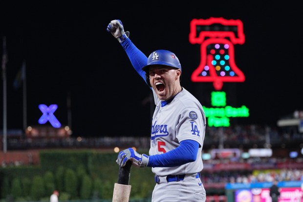The Dodgers’ Freddie Freeman reacts after teammate Teoscar Hernández hit...