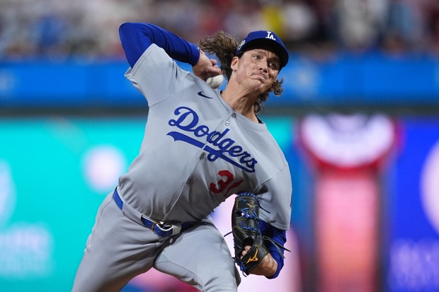 Dodgers relief pitcher Tyler Glasnow throws to the plate during...