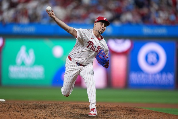 Philadelphia Phillies relief pitcher Orion Kerkering pitches during the eighth...