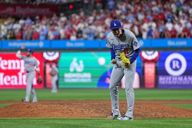 Dodgers relief pitcher Roki Sasaki reacts after the Dodgers defeated...