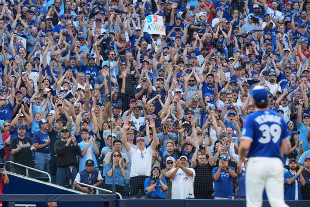 Fans give a standing ovation as Toronto Blue Jays pitcher...